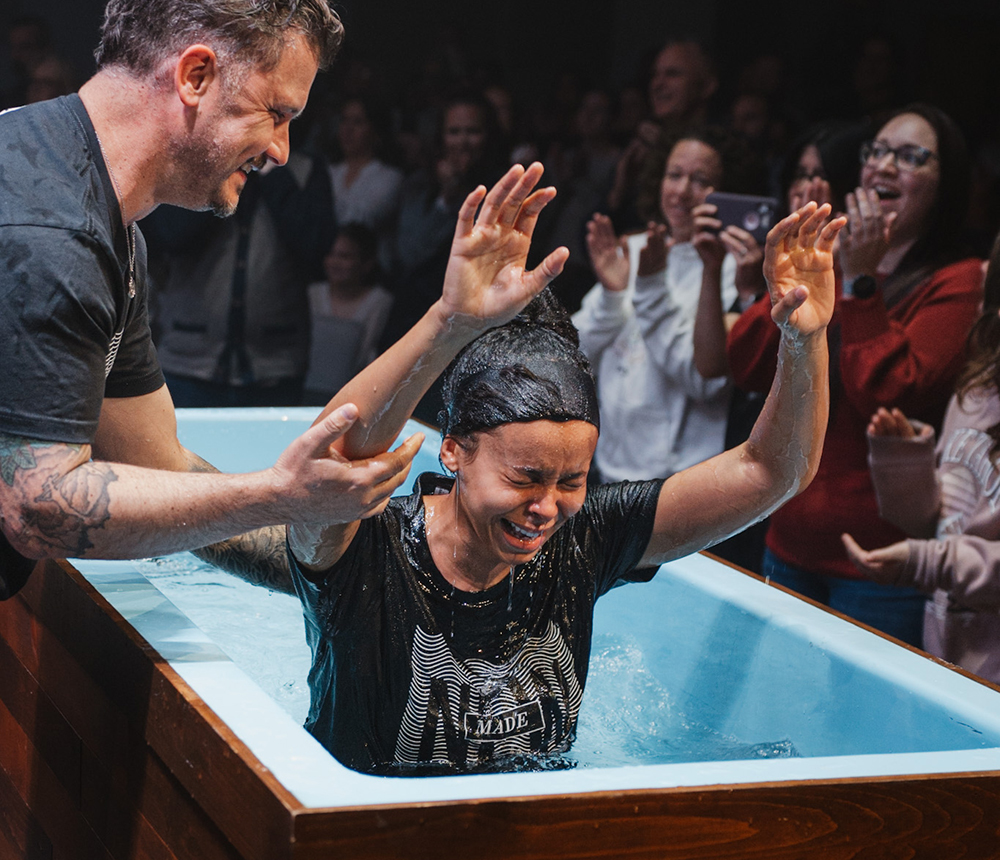 young woman being water baptized