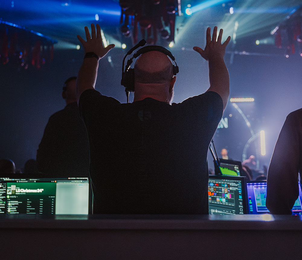 Production team lifted hands in worship