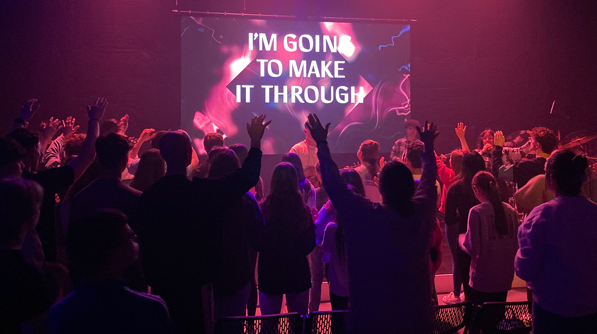 youth hands lifted in worship